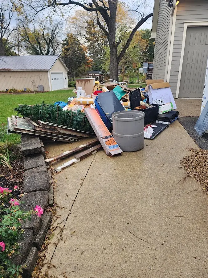 Dumpster being loaded with debris for 30 Yard Dumpster Rental in Avon Park